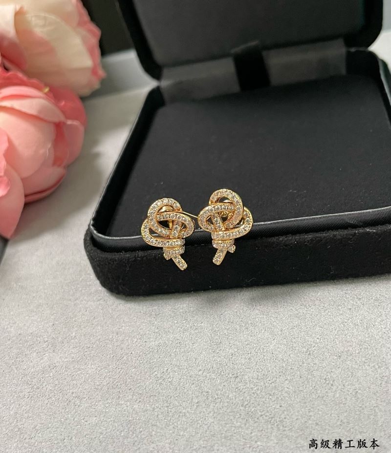 T*f*ny earrings